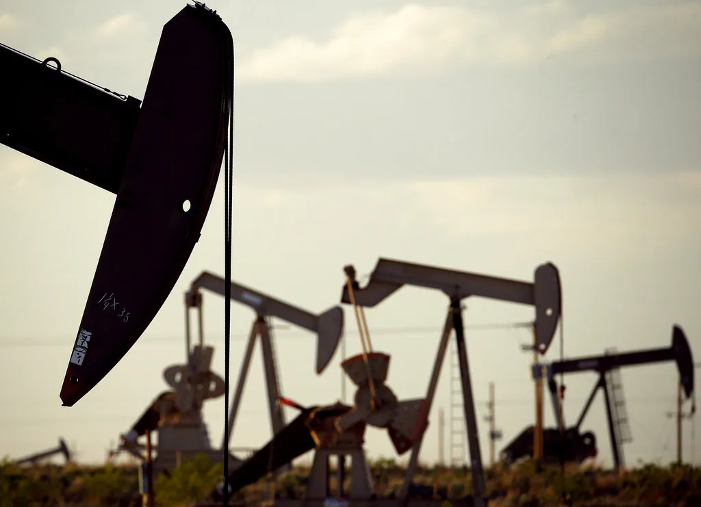  pumpjacks work in a field near Lovington, N.M In this April 24, 2015. The United States may have reclaimed the title of the world's biggest oil producer sooner than expected.  (Charlie Riedel/AP)