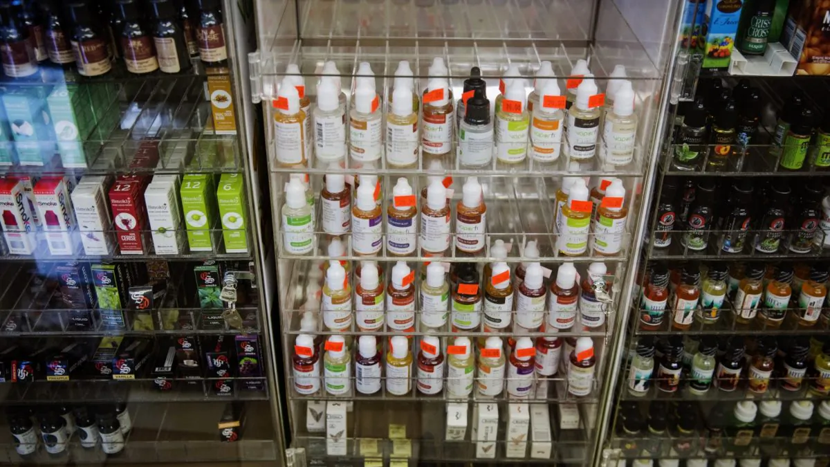 Bottles of flavor packets for e-cigarettes stand displayed in a tobacco shop in New York on June 23, 2015. (Reuters/Lucas Jackson)