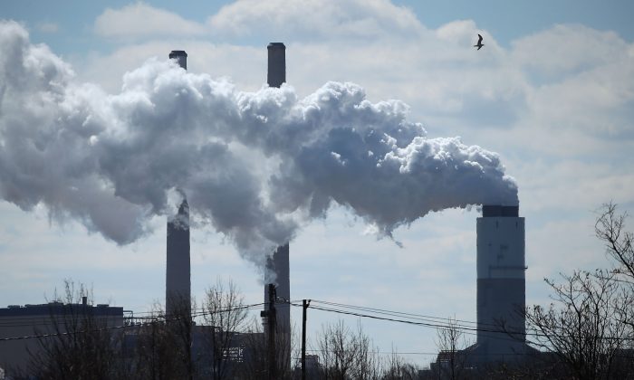 Smoke emerges from a large stack at the coal-fired Brandon Shores Power Plant in Baltimore, Md., on March 9, 2018. (Mark Wilson/Getty Images)