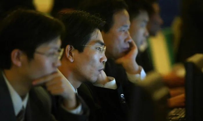 Chinese officials surf the internet in Beijing, on March 14, 2004. (FREDERIC J. BROWN/AFP/Getty Images)