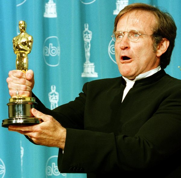 Actor Robin Williams holds the Oscar he won for Be