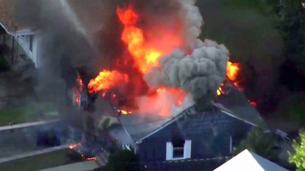 Flames consume a home in Lawrence