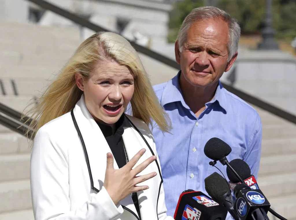 Elizabeth Smart during a news conference in Salt Lake City, Utah, while her father Ed Smart looks on, on Sept. 13, 2018. (Rick Bowmer/AP Photo)