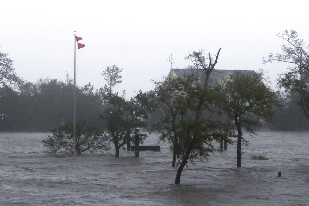 High winds and storm surge from Hurricane Florence hits Swansboro N.C.,Friday, Sept. 14, 2018. (AP Photo/Tom Copeland)
