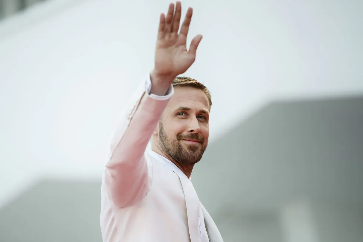 Actor Ryan Gosling waves as he arrives for the opening ceremony and the premiere of the film "First Man", presented in competition at the 75th Venice Film Festival at Venice Lido, on Aug. 29, 2018.         (Filippo Monteforte/AFP/Getty Images)
