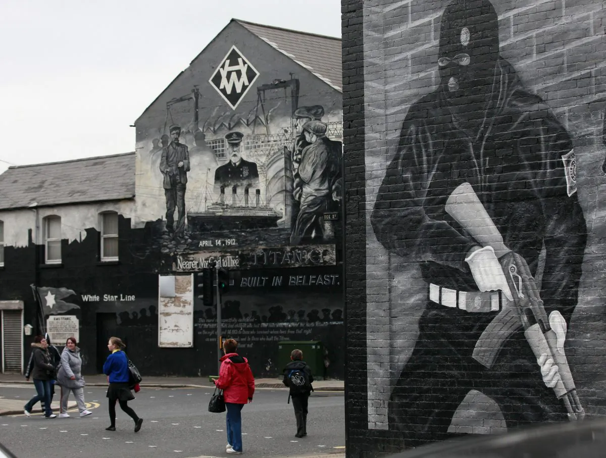 People walk pass a mural relating to the Titanic in Belfast, Northern Ireland on March 13, 2012. (Peter Muhly/AFP/Getty Images)