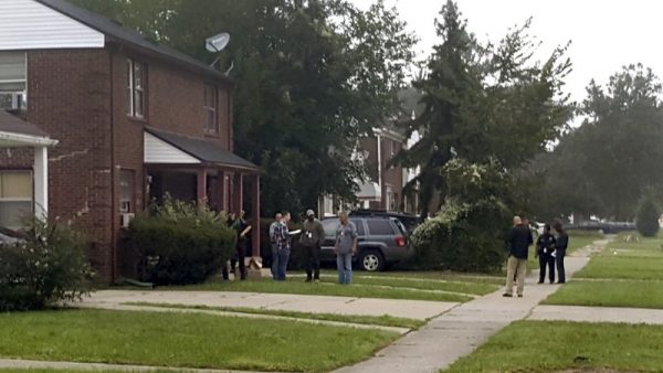 Police gather at a Detroit home