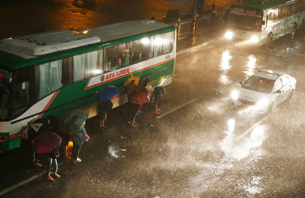 People evacuating in heavy rain