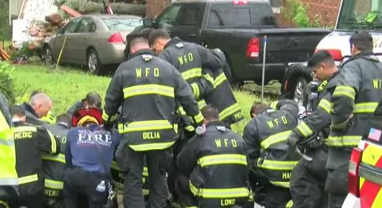 Firefighters Kneel and Pray at Site Where Mother and Baby Killed by Hurricane Florence