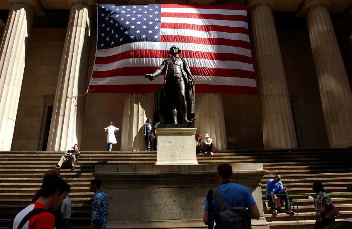An American flag is displayed behind a statue of George Washington in a Sept. 2002 file photo in New York City. (Spencer Platt/Getty Images)