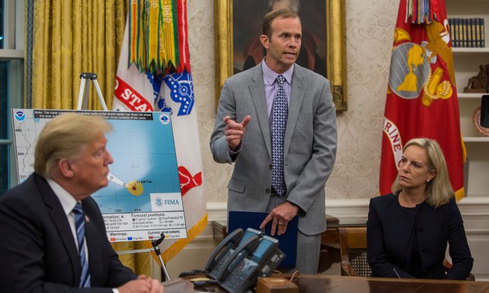 FEMA Administrator Brock Long (C) after briefing President Donald Trump on Hurricane Florence in the Oval Office at the White House on Sept. 11, 2018. (Zach Gibson/AFP/Getty Images)