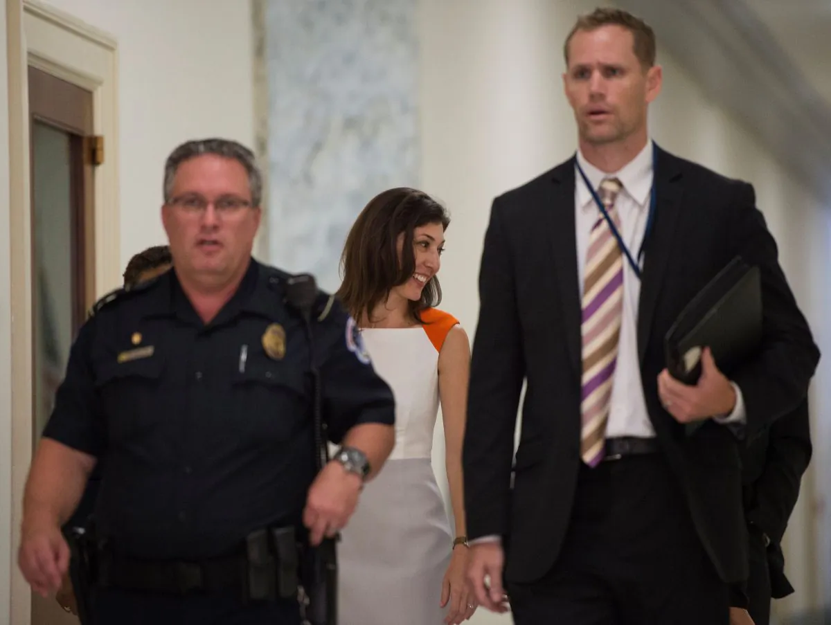 Lisa Page (C), former legal counsel to former FBI Director Andrew McCabe, arrives on Capitol Hill to speak before the House Judiciary and Oversight Committee on July 16, 2018. (ANDREW CABALLERO-REYNOLDS/AFP/Getty Images)