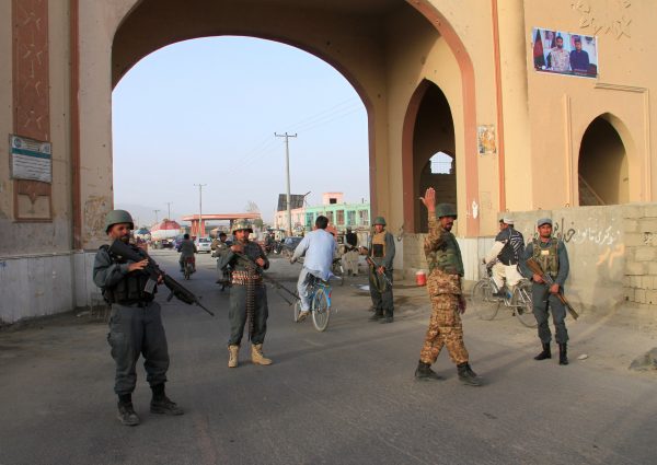 Afghan policemen keep watch
