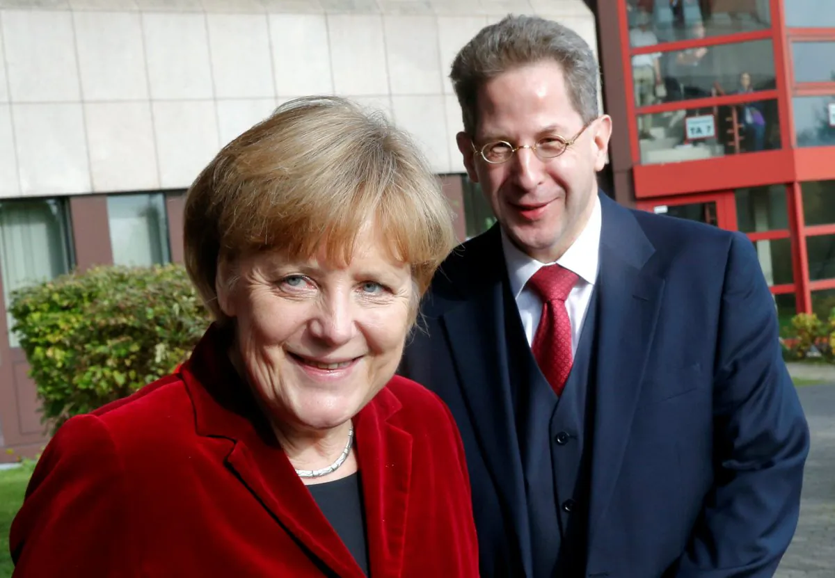 German Chancellor Angela Merkel and Hans-Georg Maassen, the President of the Federal Office for the Protection of the Constitution, Germany's domestic security agency in Cologne, Germany on Oct. 31, 2014. (Reuters/Wolfgang Rattay/File Photo)