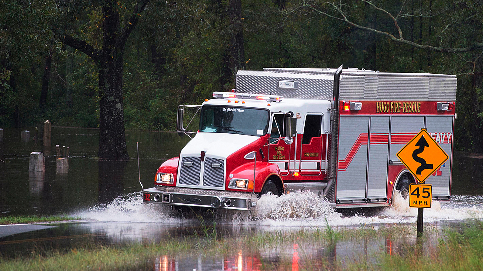An emergency truck drives through Hurricane Florence’s flood water