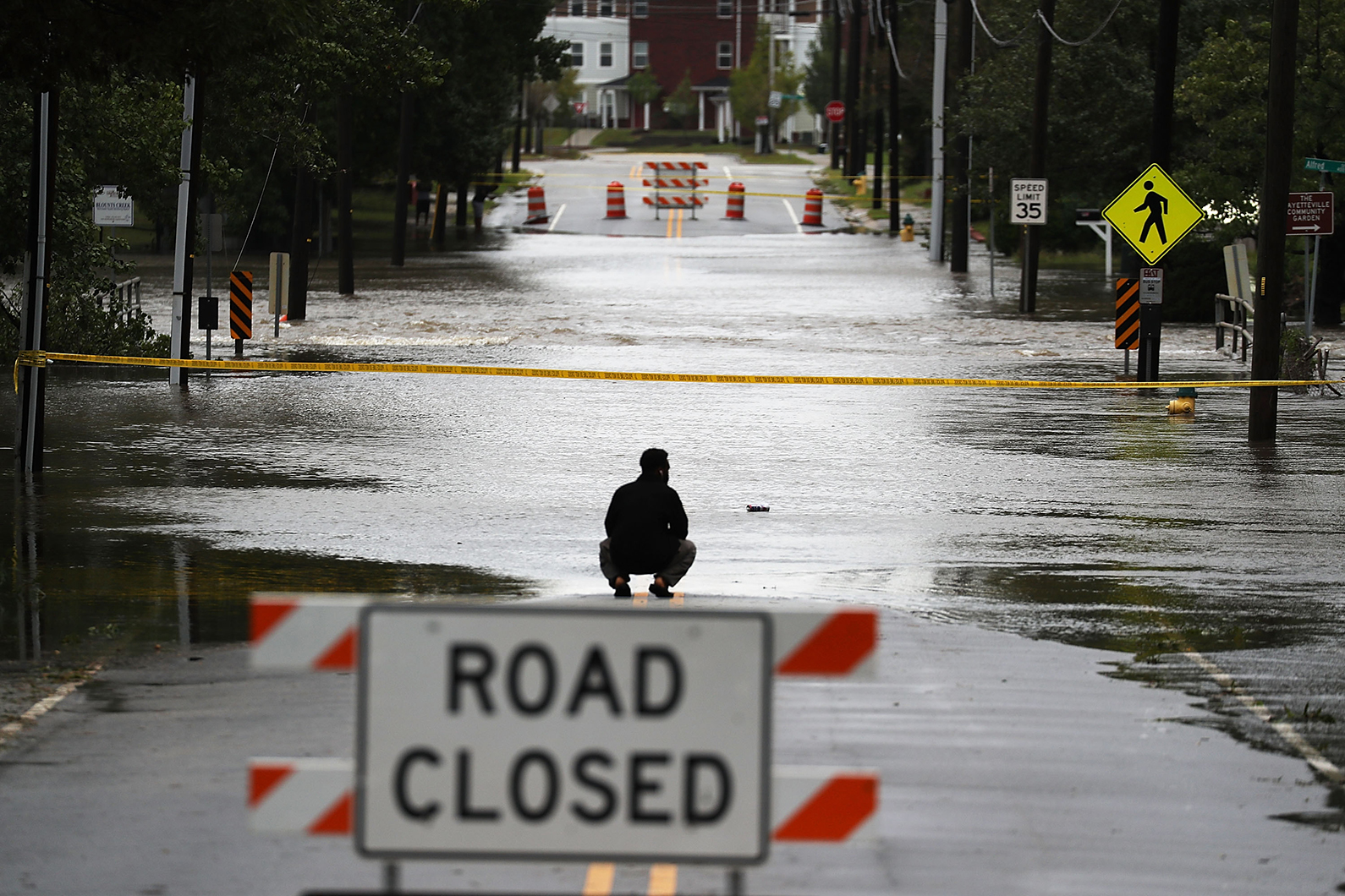 A road is washed out by the rains from Hurricane Florence