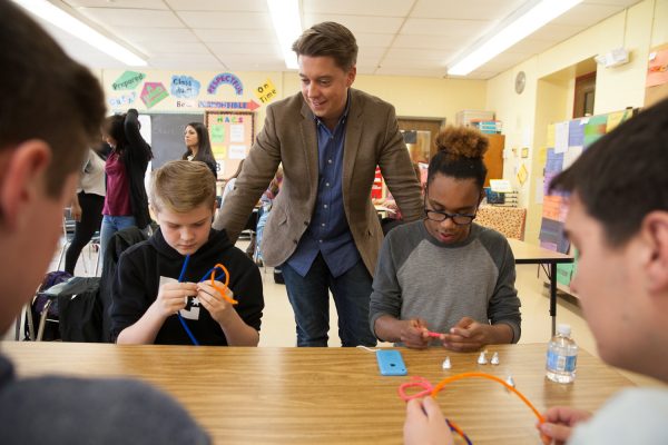 Marcus Soutra working with students