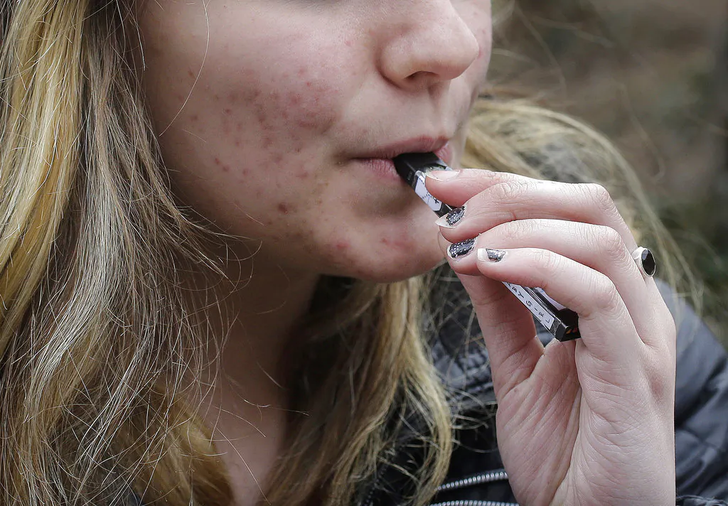 A woman vapes in a file photograph. (Steven Senne/AP Photo)