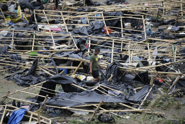 makeshift tent shelters damaged by Typhoon Mangkhut