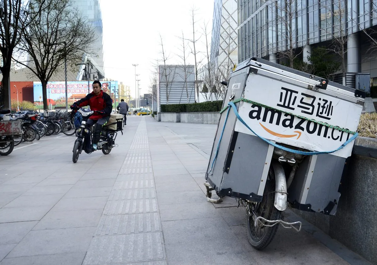 An electric bike (R) used by Amazon sits parked along the pavement at a central business district in Beijing on November 29, 2012. (WANG ZHAO/AFP/Getty Images)