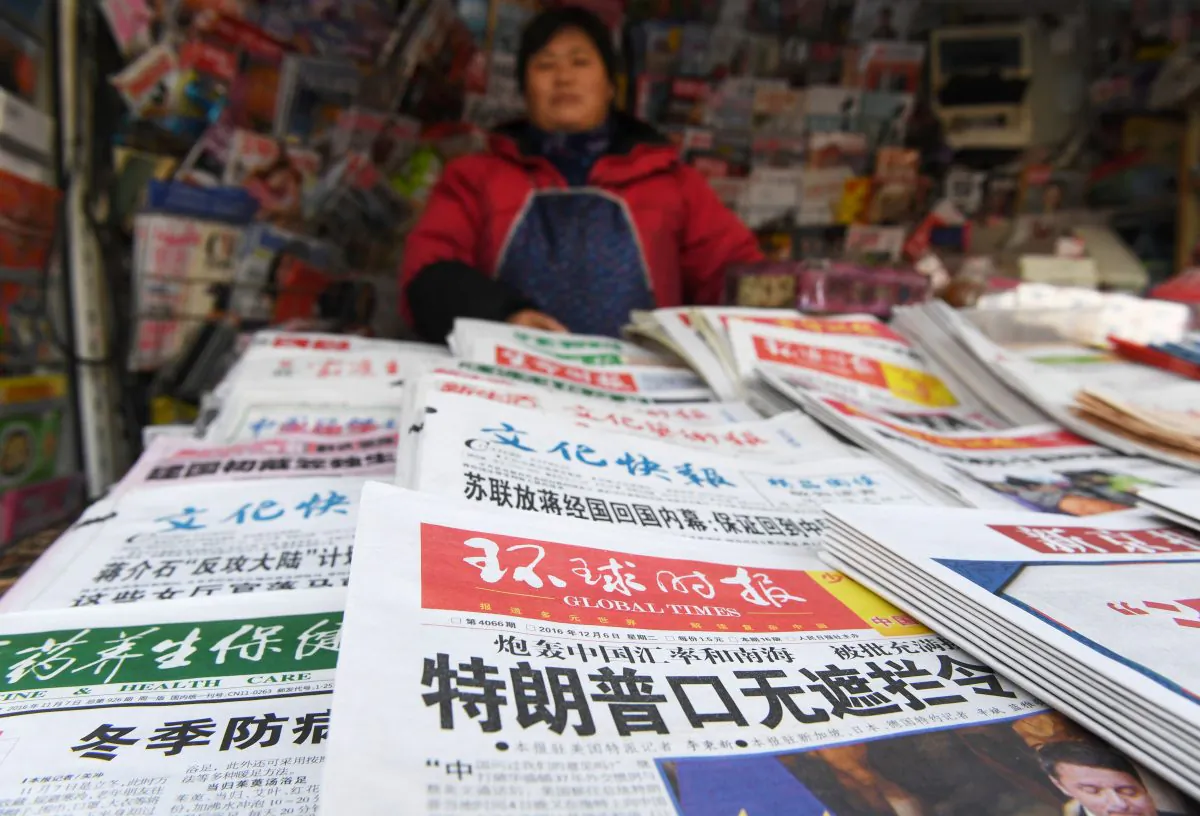 A Chinese newsstand with state-run newspapers on sale, in Beijing on December 6, 2016. (Greg Baker/AFP/Getty Images)