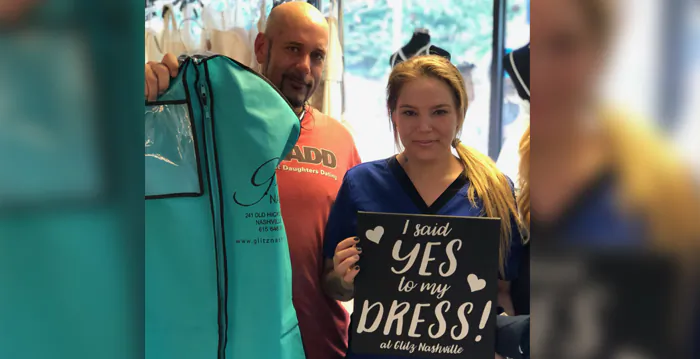 Virginia Stanley and her fiancé, Douglas Lauderdale, picking up her dress from Gritts Bridal Store (Courtesy of Virginia Stanley) 