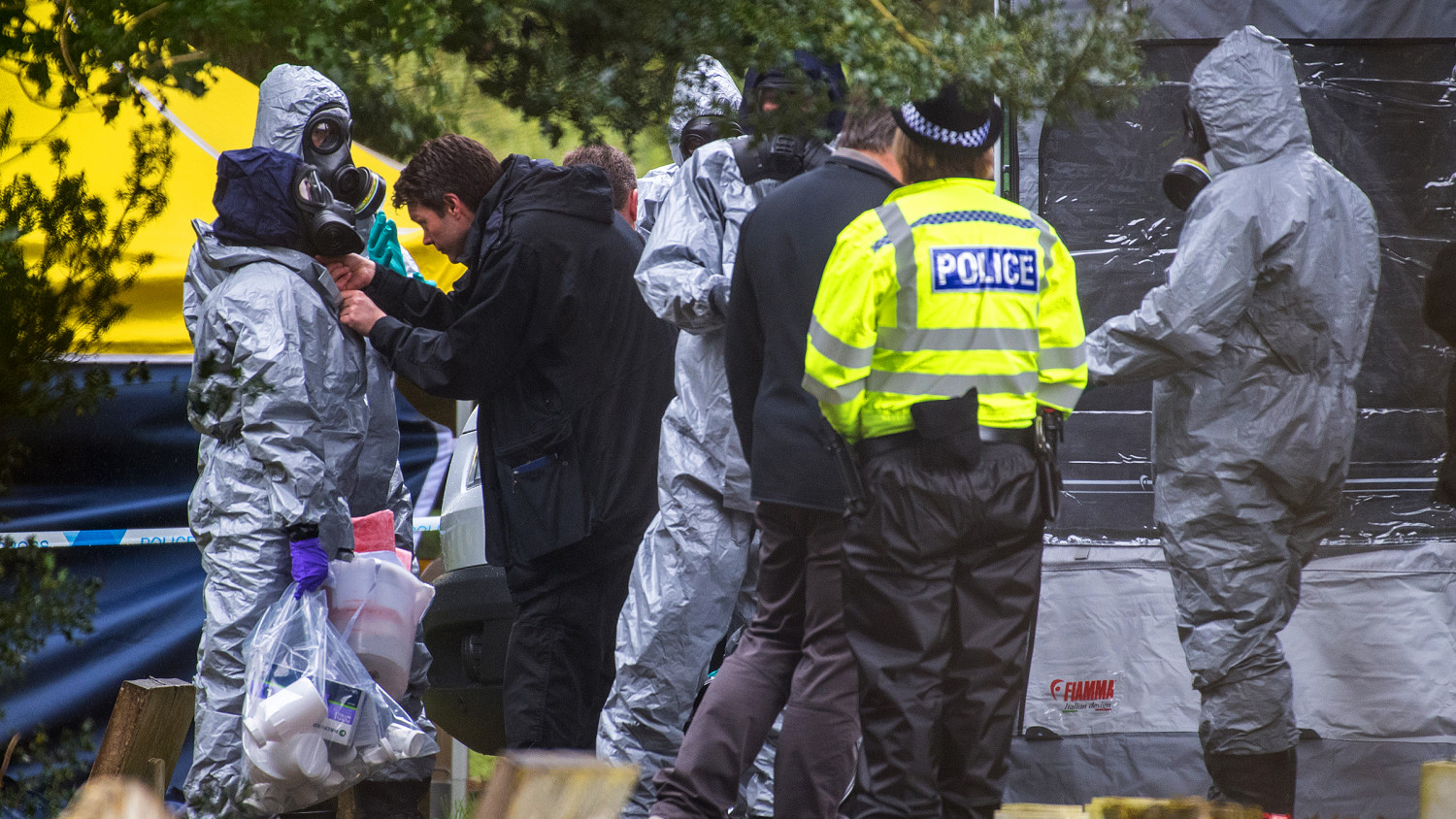 Police officers wear protective suits and breathing apparatus in London Road cemetery as they continue investigations into the poisoning of Sergei Skripal who was found critically ill on a bench in Salisbury on March 10, 2018 in Salisbury, England. (Chris J Ratcliffe/Getty Images)