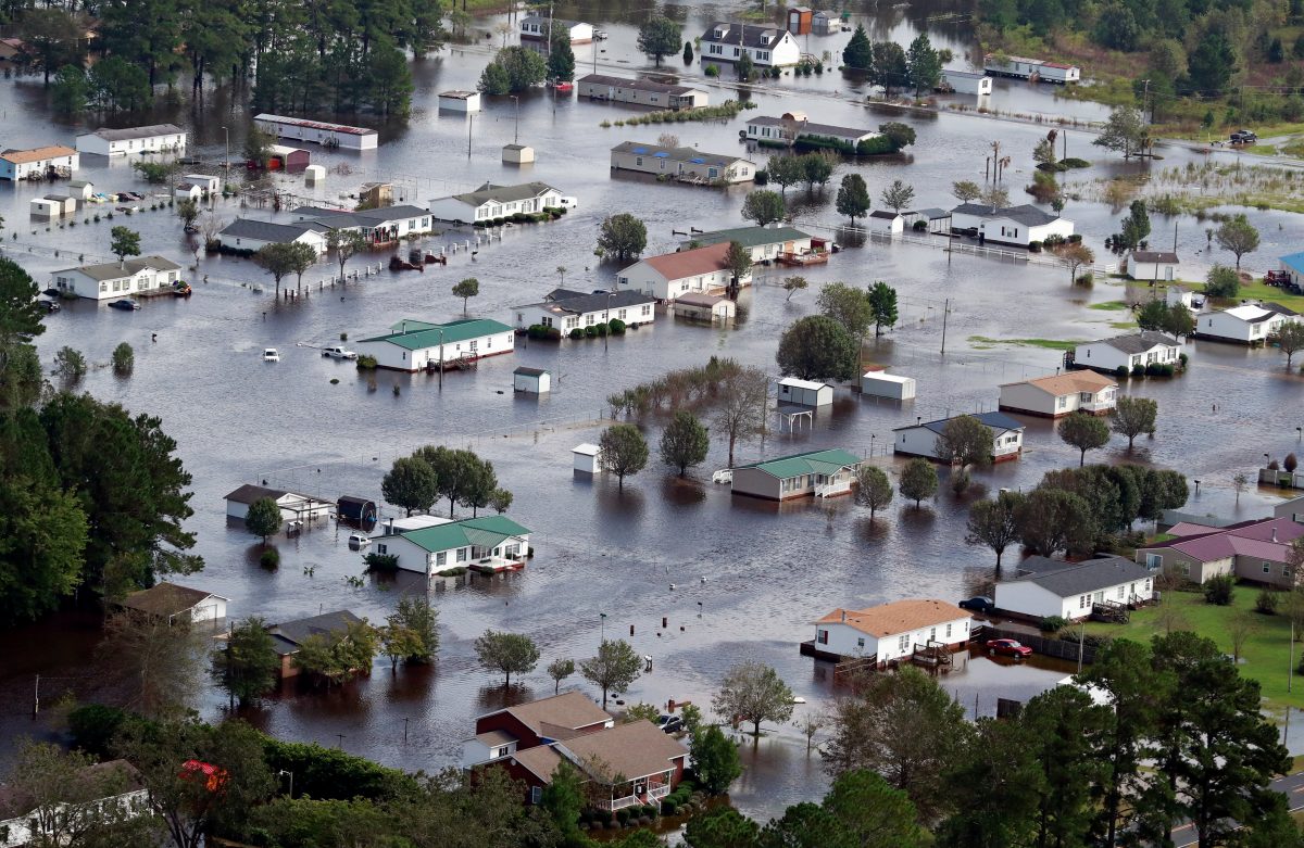 Houses sit in floodwater