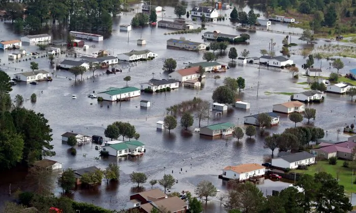 2 Mental Patients Chained in Back of Sheriff’s Van Drown During Florence
