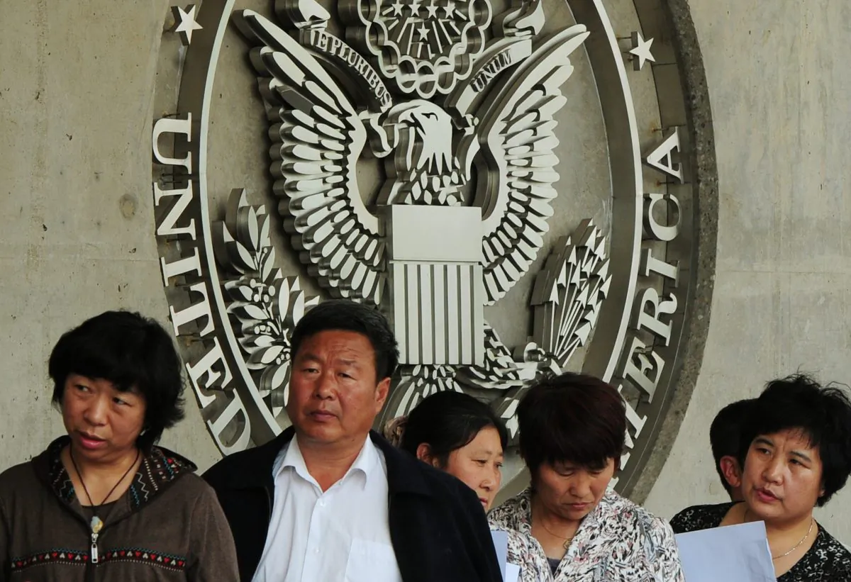 Chinese citizens wait to submit their visa applications at the U.S. Embassy in Beijing on May 2, 2012. (Mark Ralston/AFP/Getty Images)