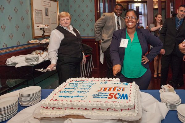 Shaliyah Ali cutting the cake