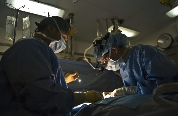 Doctors perform surgery on a patient