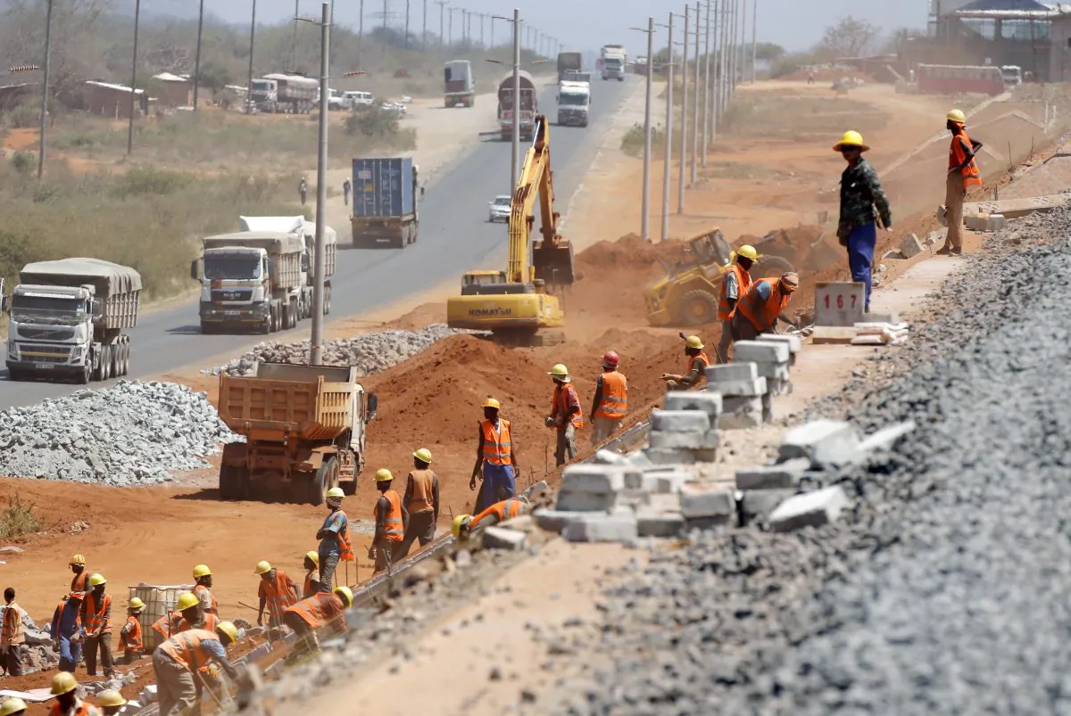 Construction workers work on a railway line near Voi town, Kenya on March 16, 2016. (Goran Tomasevic/Reuters)