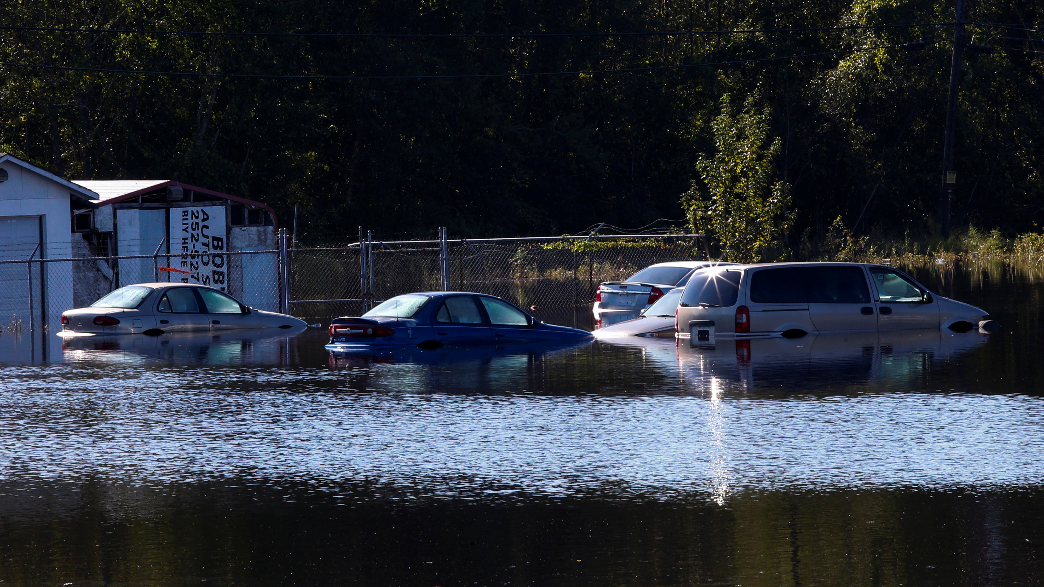 Cars submerged in water after hurricane