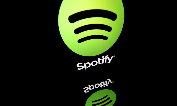 This illustration picture taken on April 19, 2018 shows the logo of online streaming music service Spotify displayed on a tablet screen in Paris.      (Lionel Bonaventure/AFP/Getty Images)
