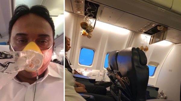 Passengers and oxygen masks inside the cabin of a Jet Airways flight