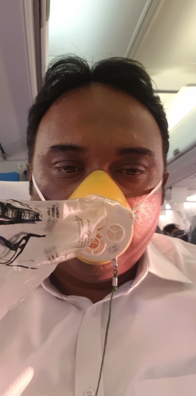 Jet Airways passenger wears an oxygen mask