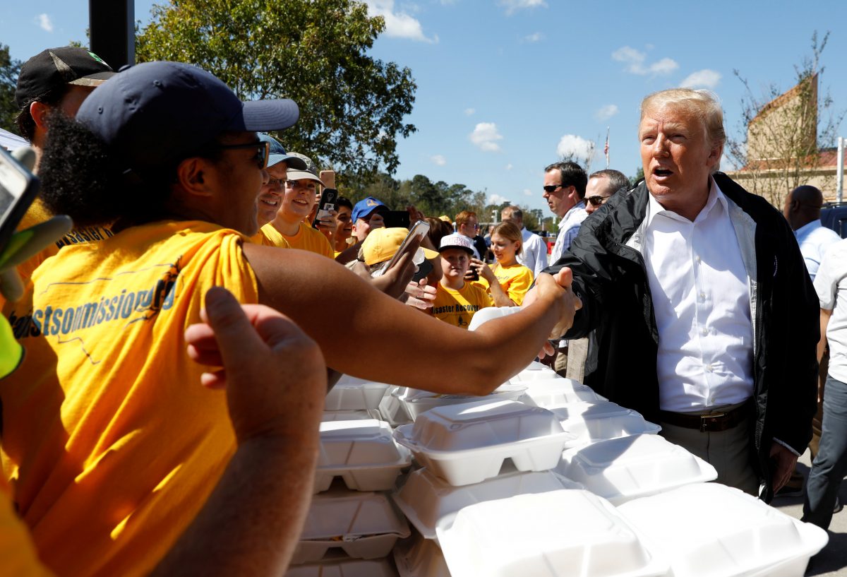 Trump hands out food to hurricane victims