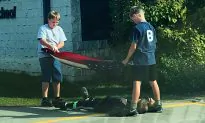 Students Show Respect While Folding the Nation’s Flag
