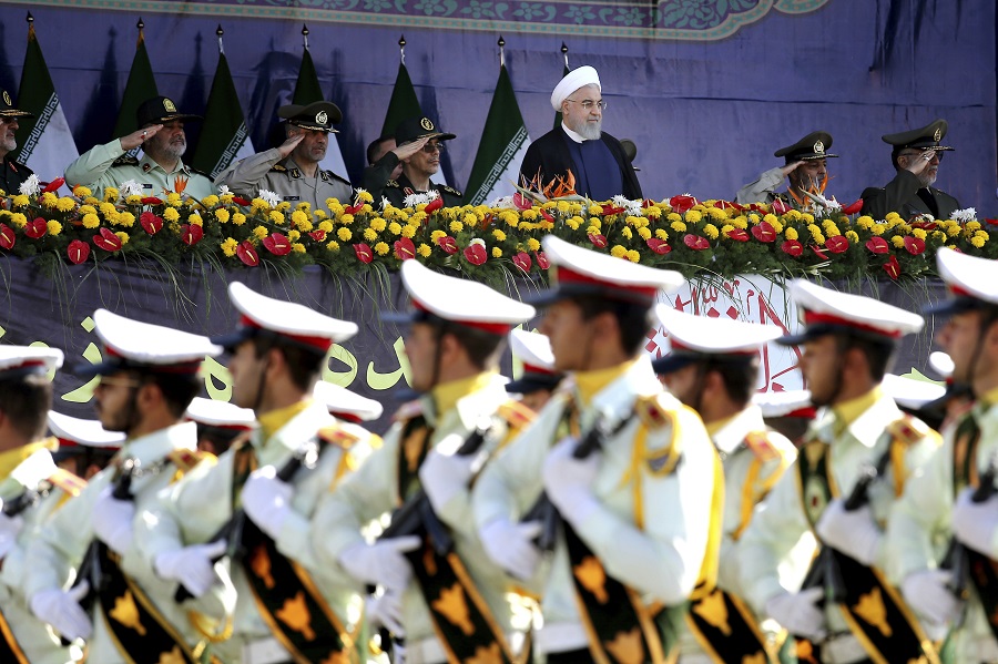 Iranian armed forces members march.jpg