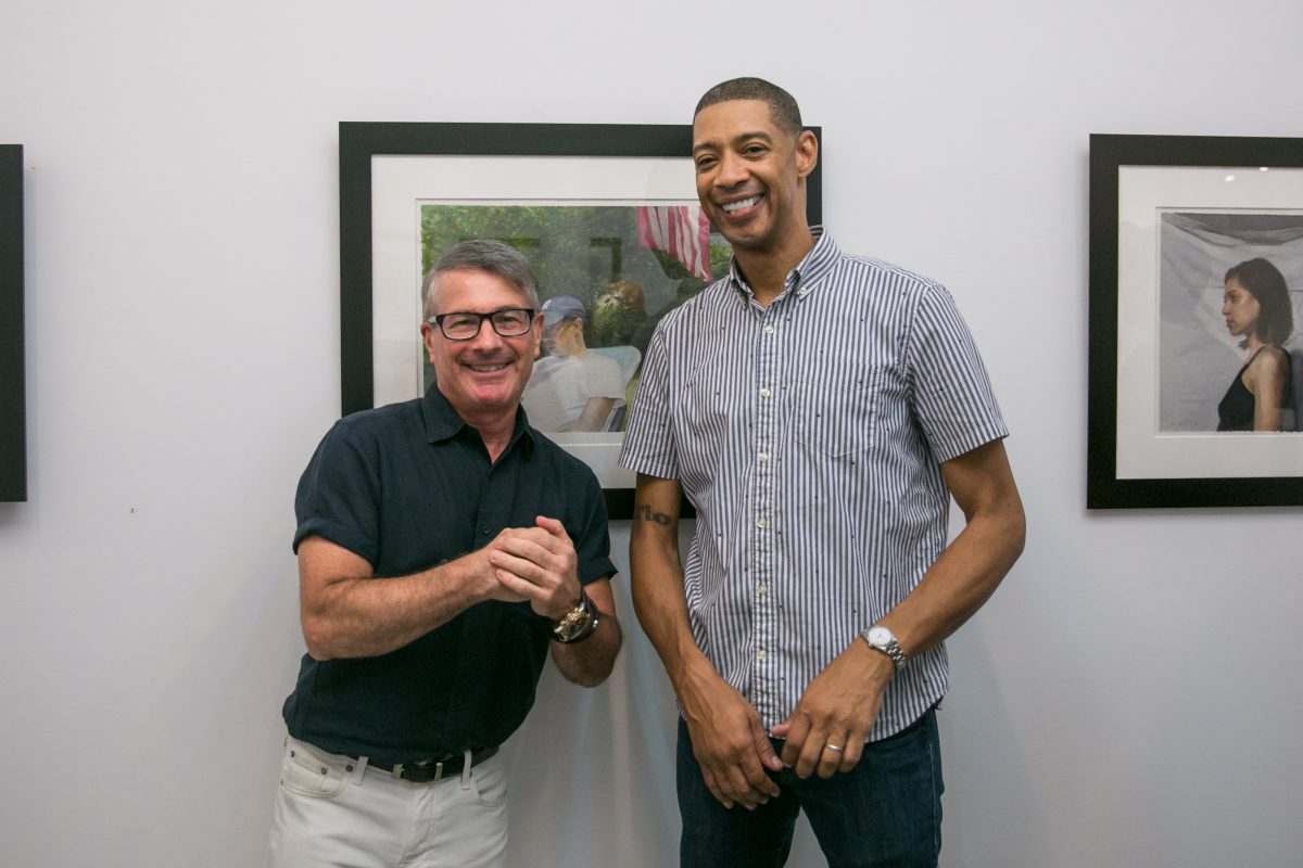 Art dealer, Frank Bernarducci and artist Mario A. Robinson pose for a photo during the opening of the exhbition of Robinson's work at the Bernarducci Gallery in the Chelsea district of New York, on September 6, 2018. (Milene Fernandez/The Epoch Times)