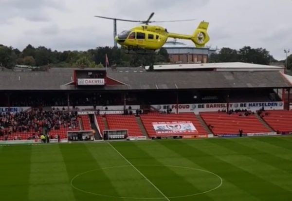 helicopter lands on the field of a stadium