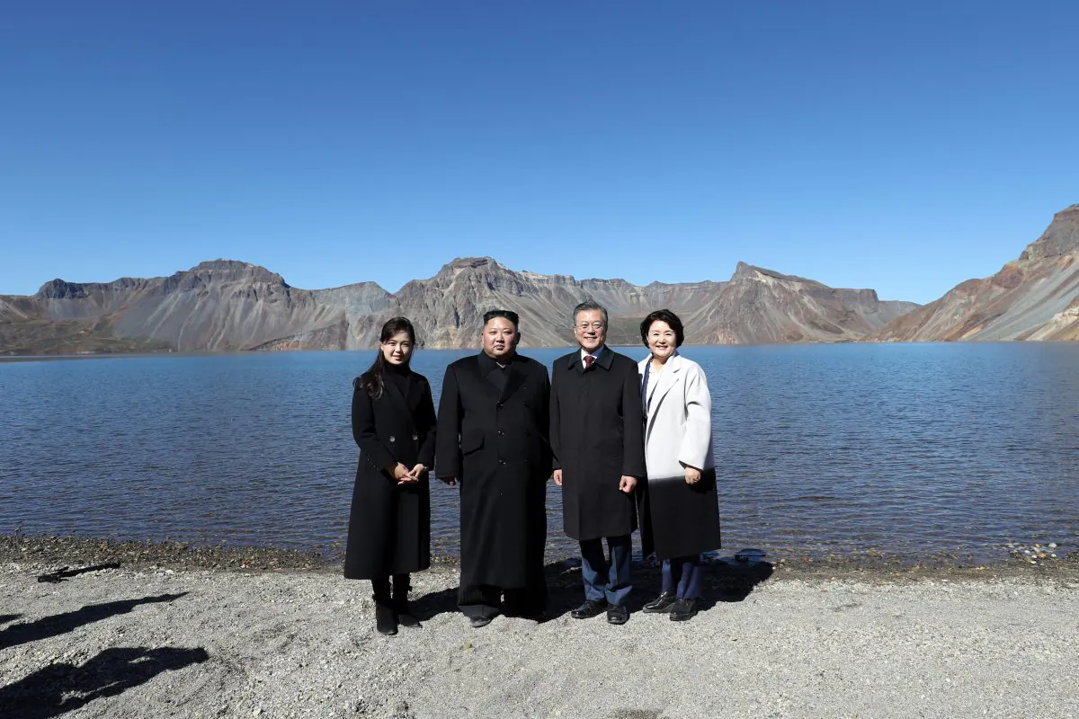 North Korean leader Kim Jong Un (2nd L) and his wife Ri Sol Ju (L) pose with South Korean President Moon Jae-in (2nd R) and his wife Kim Jung-sook (R) on the top of Mount Paektu on Sept. 20, 2018. Kim and Moon met for Inter-Korean summit talks, where they discussed ways to denuclearize the Korean Peninsula. (Pyeongyang Press Corps/Pool/Getty Images)