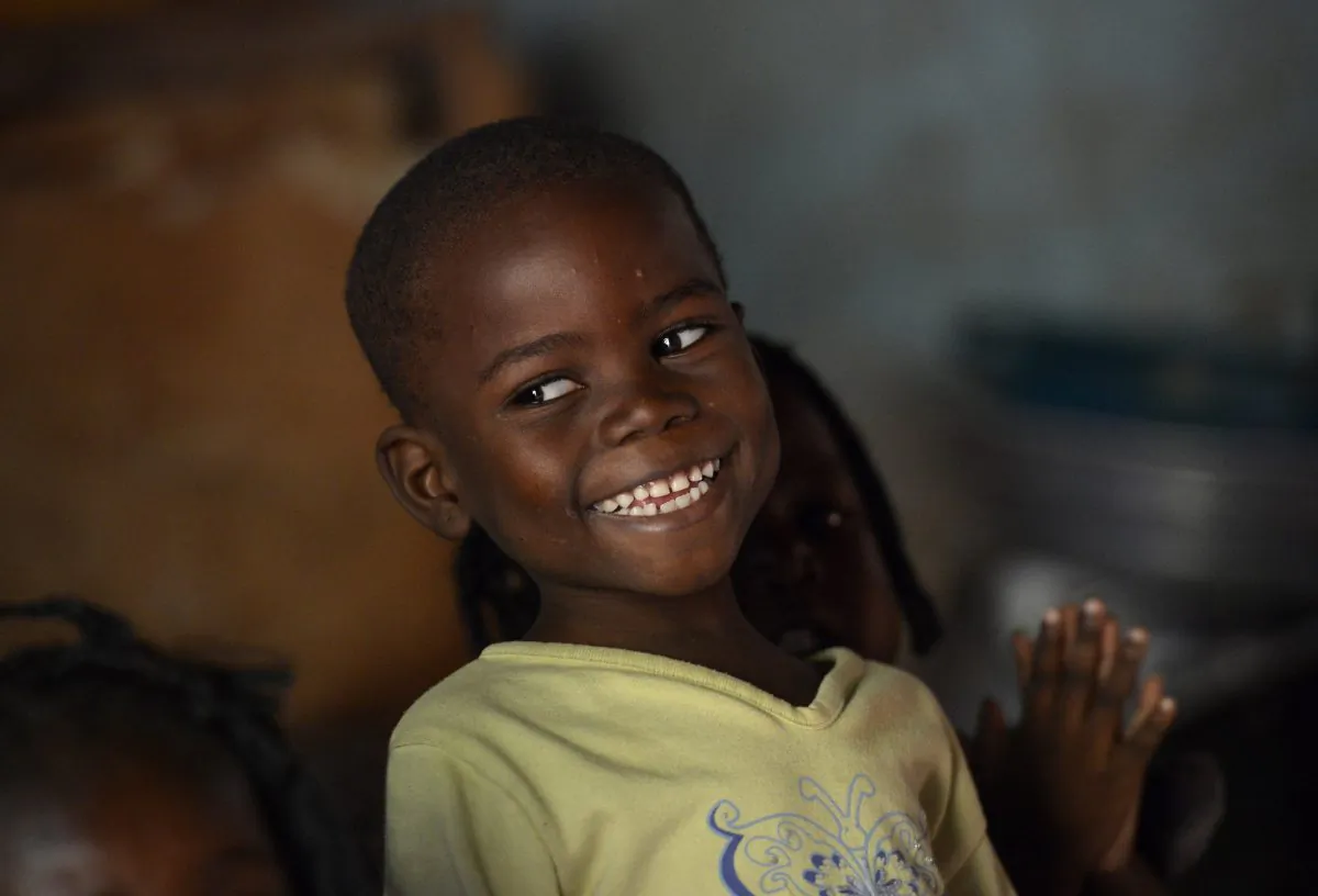 A young boy smiles at the ONO orphanage in the Mali-Maka district in the 5th arrondissement of Bangui, Central African Republic, on Jan. 6, 2014. (Miguel Medina/AFP/Getty Images)