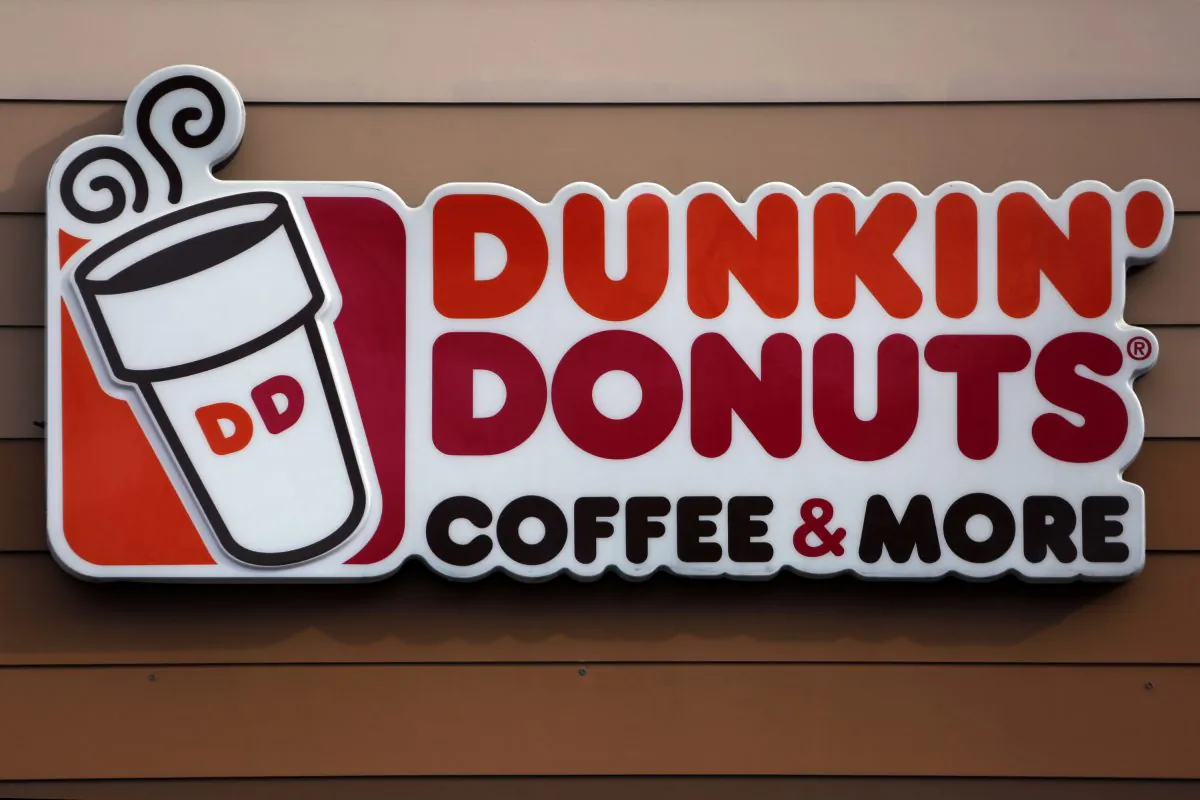 The company is renaming itself Dunkin' to reflect its increasing emphasis on coffee and other drinks. The change will officially take place in January 2019. (Gene J. Puskar, File/AP)