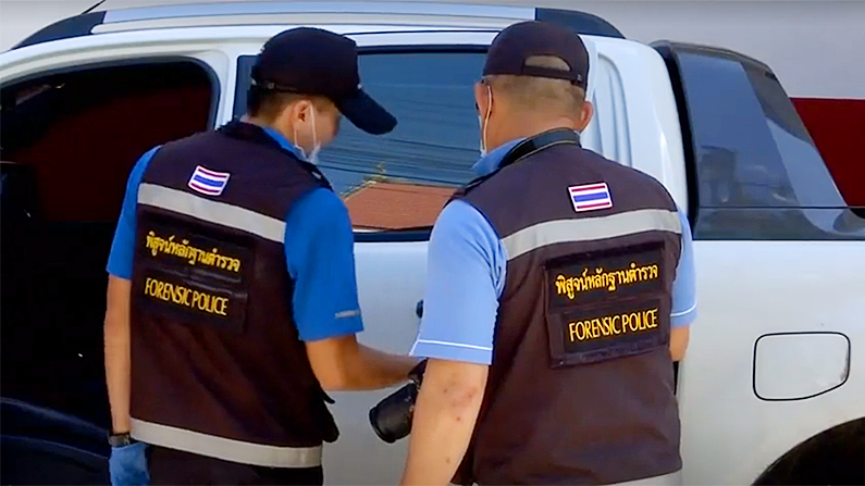 Police examine the stolen Ford pick-up