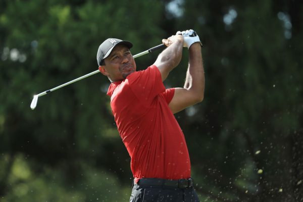 Tiger Woods makes a shot