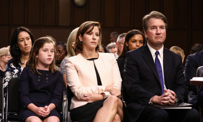 Judge Brett Kavanaugh sits next to his wife Ashley Kavanaugh, and daughter Liza, before the Senate Judiciary Committee on the U.S. Supreme Court at the Capitol in Washington on Sept. 4, 2018. (Samira Bouaou/The Epoch Times)