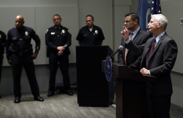 Police speak to reporters