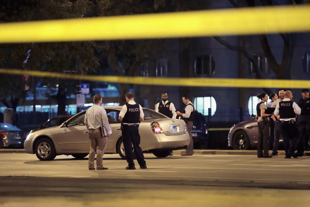 Police investigate the scene of a shooting near the Chinatown neighborhood where four people were shot in an apparent road rage incident on September 19, 2018 in Chicago, Illinois. A 6-month-old infant boy and a thirteen-year-old girl were among the victims. (By Scott Olson/Getty Images)